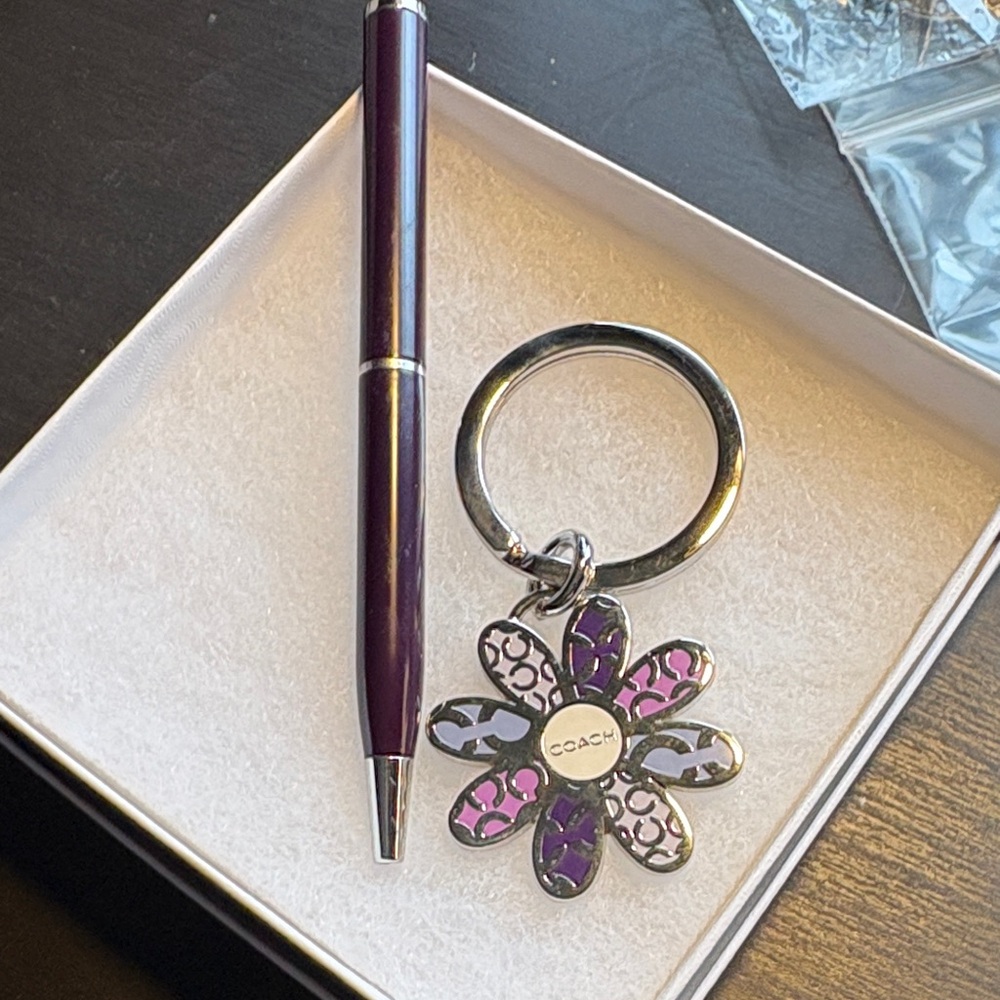 Coach Purple and Silver mini pen and a daisy Floral Coach Keychain.NWOT.
